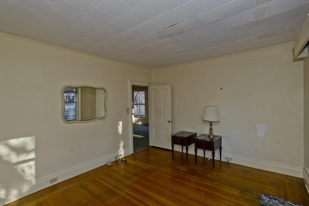 115 Thompson Street Springfield, MA 01109 - Photo 13 of 39 a living room with furniture and a wooden floor