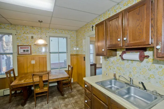 a kitchen with stainless steel appliances granite countertop a stove and a refrigerator