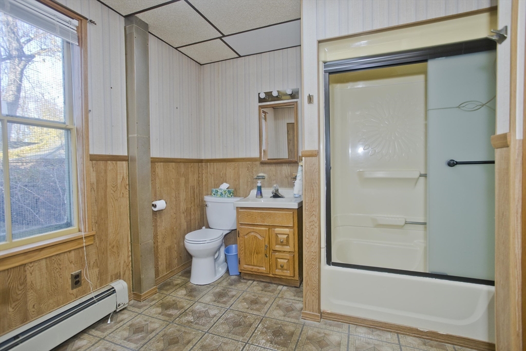 115 Thompson Street Springfield, MA 01109 - Photo 23 of 39 a bathroom with a granite countertop sink toilet and shower