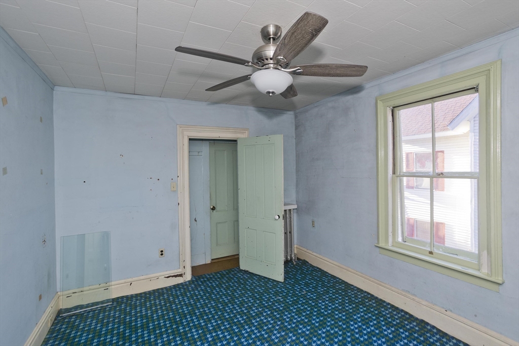 115 Thompson Street Springfield, MA 01109 - Photo 32 of 39 a view of an empty room with a window