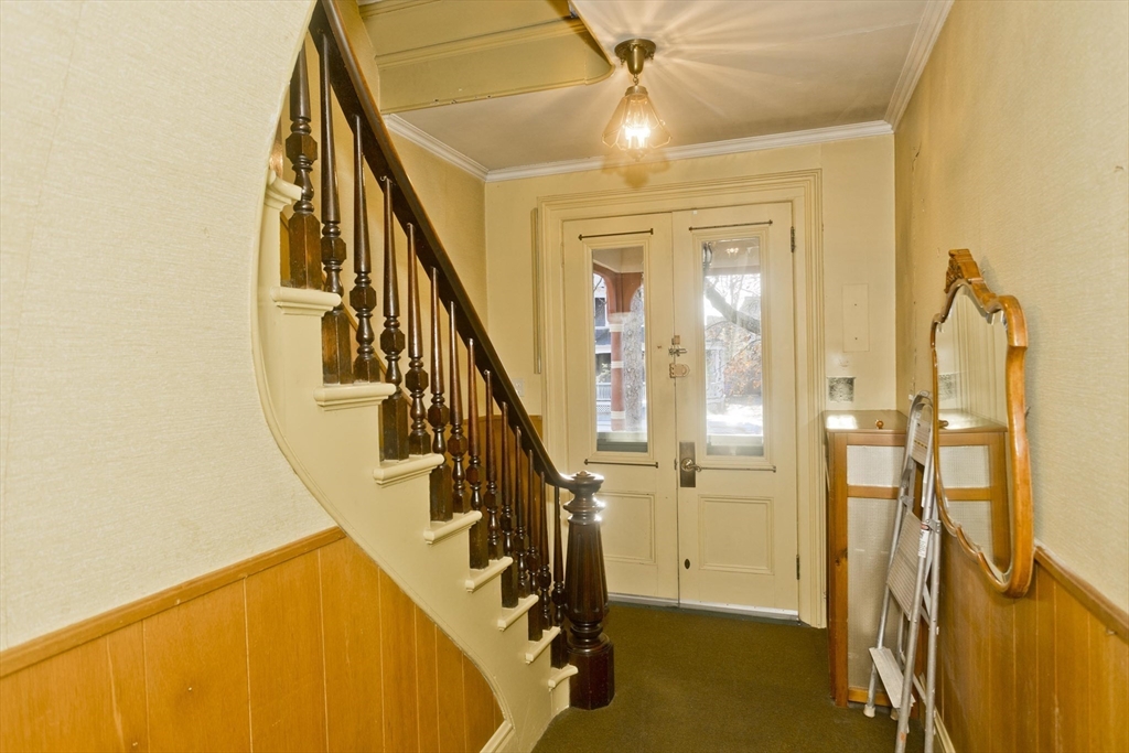 115 Thompson Street Springfield, MA 01109 - Photo 8 of 39 a view of a livingroom with wooden floor and staircase