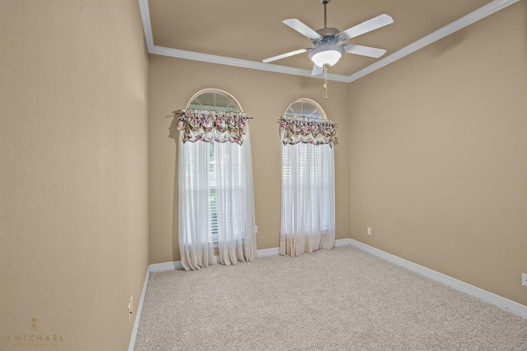 1940 Honeytree Trail Haughton, LA 71037 - Photo 12 of 21 an empty room with windows and fan