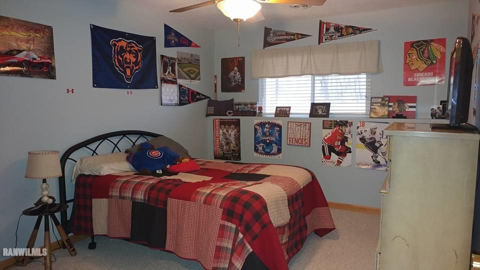1087 Winborne Road Davis, IL 61019 - Photo 13 of 17 a bedroom with bed and windows