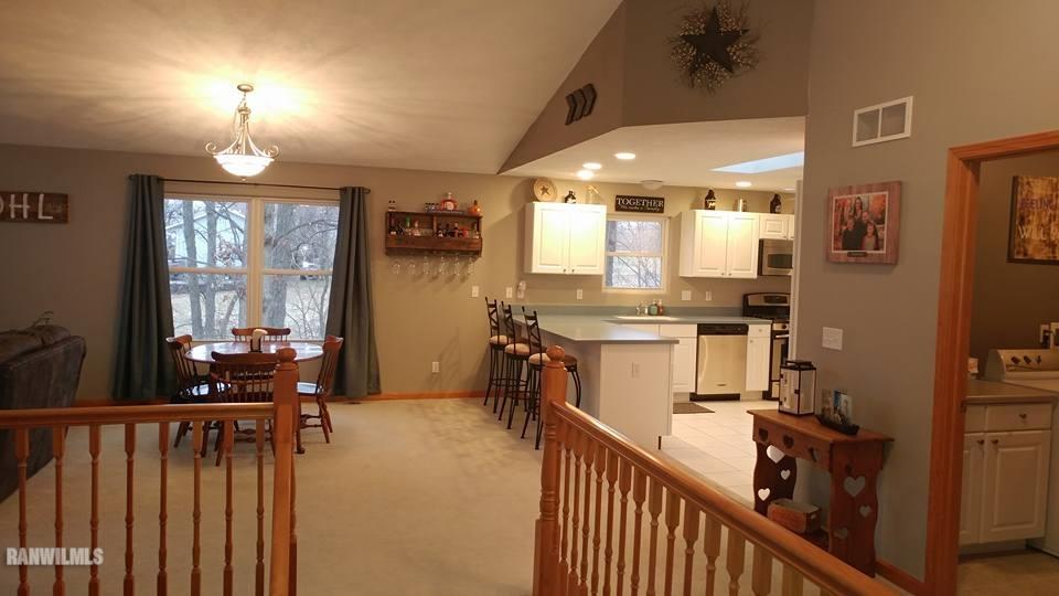 1087 Winborne Road Davis, IL 61019 - Photo 8 of 17 a kitchen with stainless steel appliances kitchen island granite countertop a stove a sink and a refrigerator