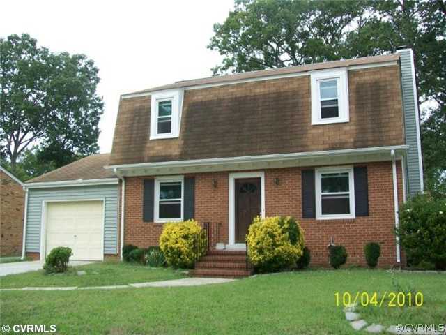 918 Williamsburg Road Colonial Heights, VA 23834 - Photo 1 of 6 a front view of a house with garden