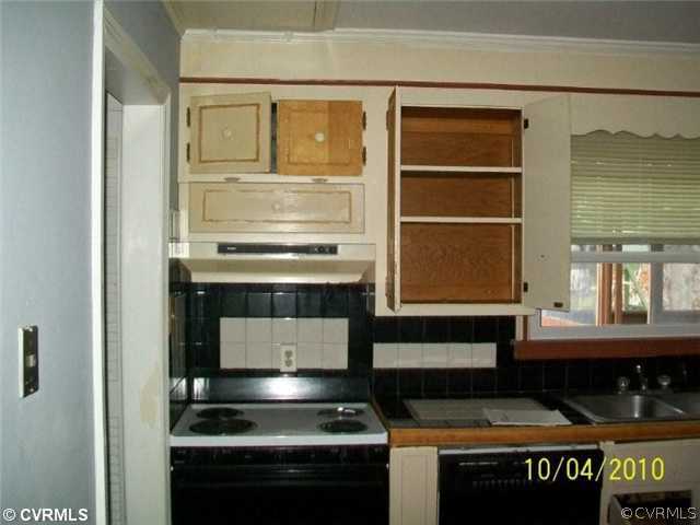 918 Williamsburg Road Colonial Heights, VA 23834 - Photo 3 of 6 a kitchen with a stove and a cabinet