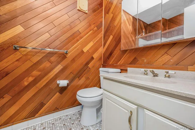 a bathroom with a sink a toilet and a shower