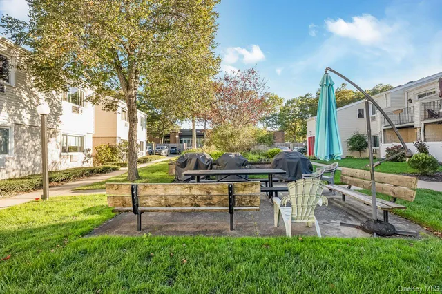 a view of yard with seating and green space
