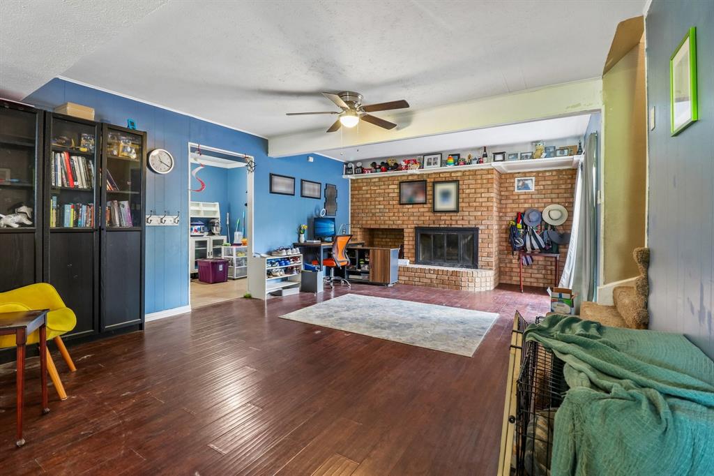820 North Bowen Road Arlington, TX 76012 - Photo 8 of 40 a living room with furniture and a fireplace