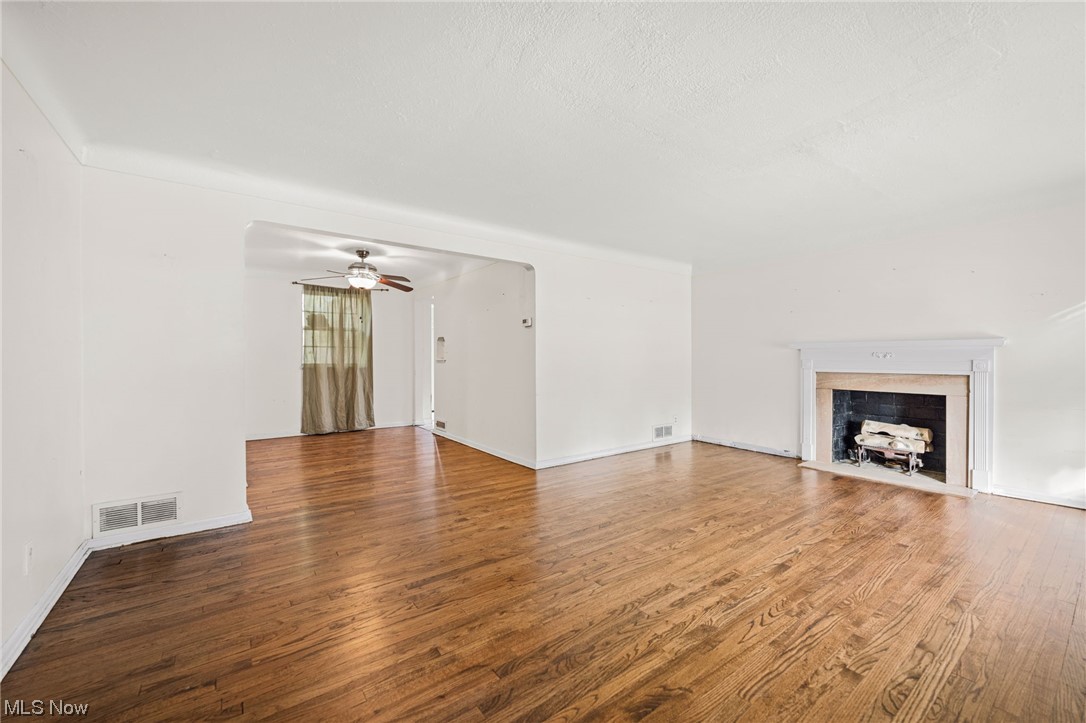 3799 Colony Road South Euclid, OH 44118 - Photo 4 of 34 Unfurnished living room featuring hardwood / wood-style floors and ceiling fan