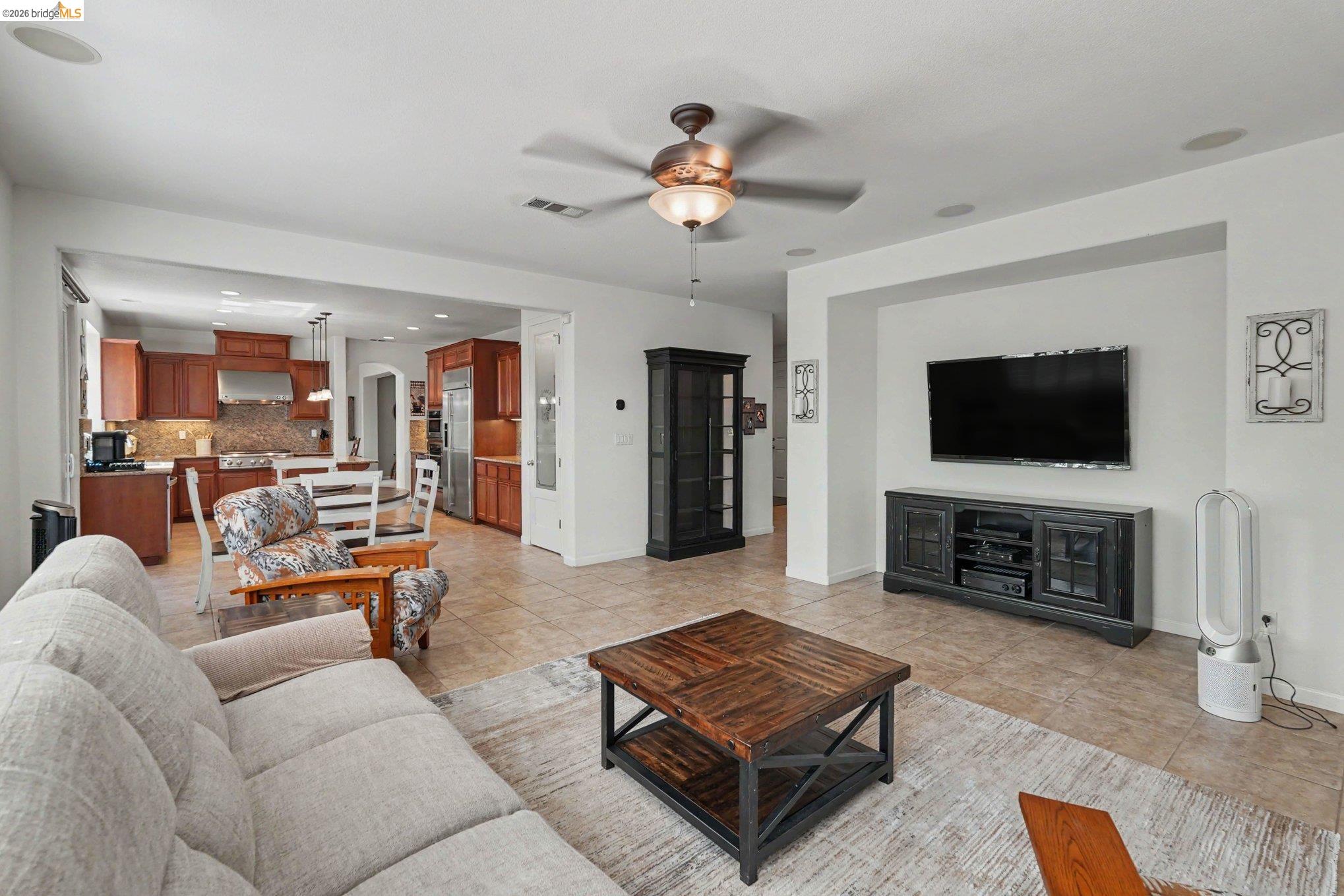 106 Little Ranch Circle Oakley, CA 94561 - Photo 12 of 34 Open concept living area featuring tile flooring, a ceiling fan, and recessed lighting