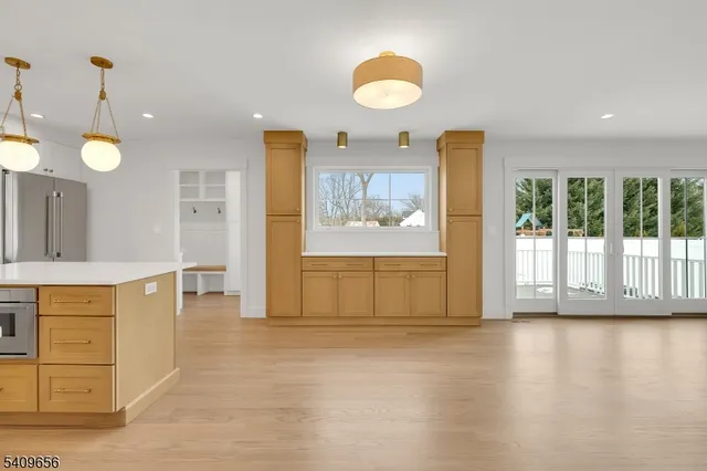 a view of a kitchen with furniture and a window