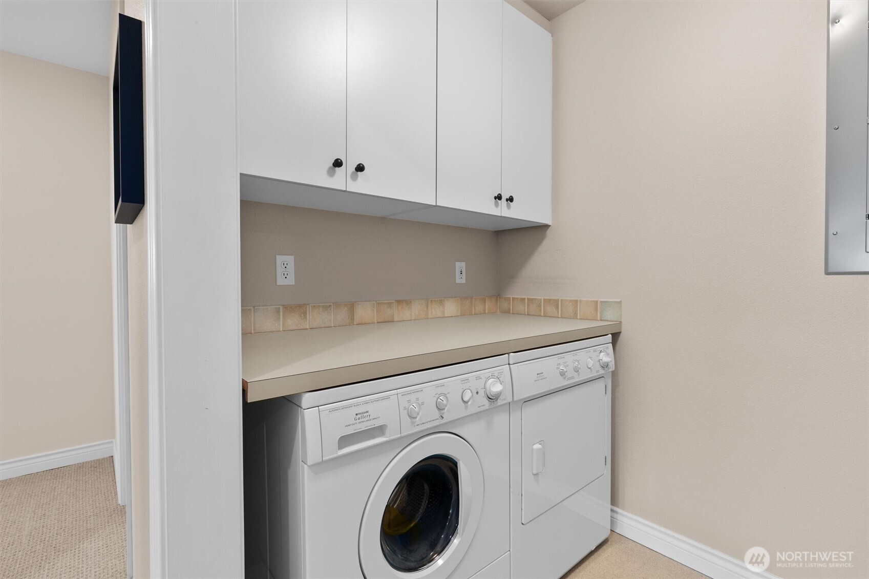 1005 Harbor Avenue Southwest, Unit 400 Seattle, WA 98116 - Photo 34 of 39 a utility room with dryer and washer