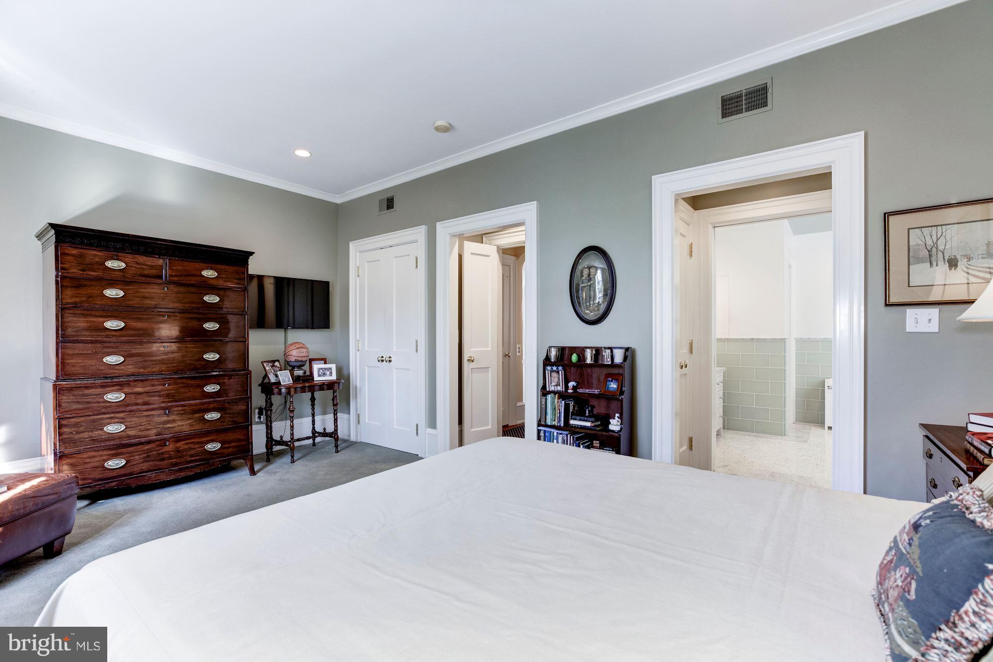 2326 California Street Northwest Washington, DC 20008 - Photo 19 of 30 a bedroom with a bed and a mirror