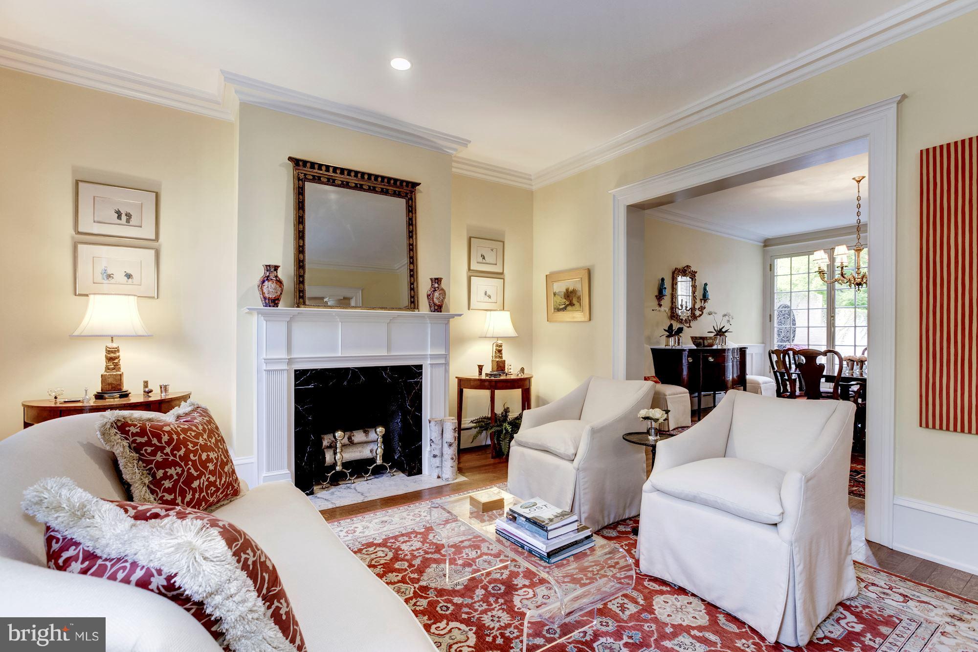 2326 California Street Northwest Washington, DC 20008 - Photo 3 of 30 a living room with furniture and a fireplace