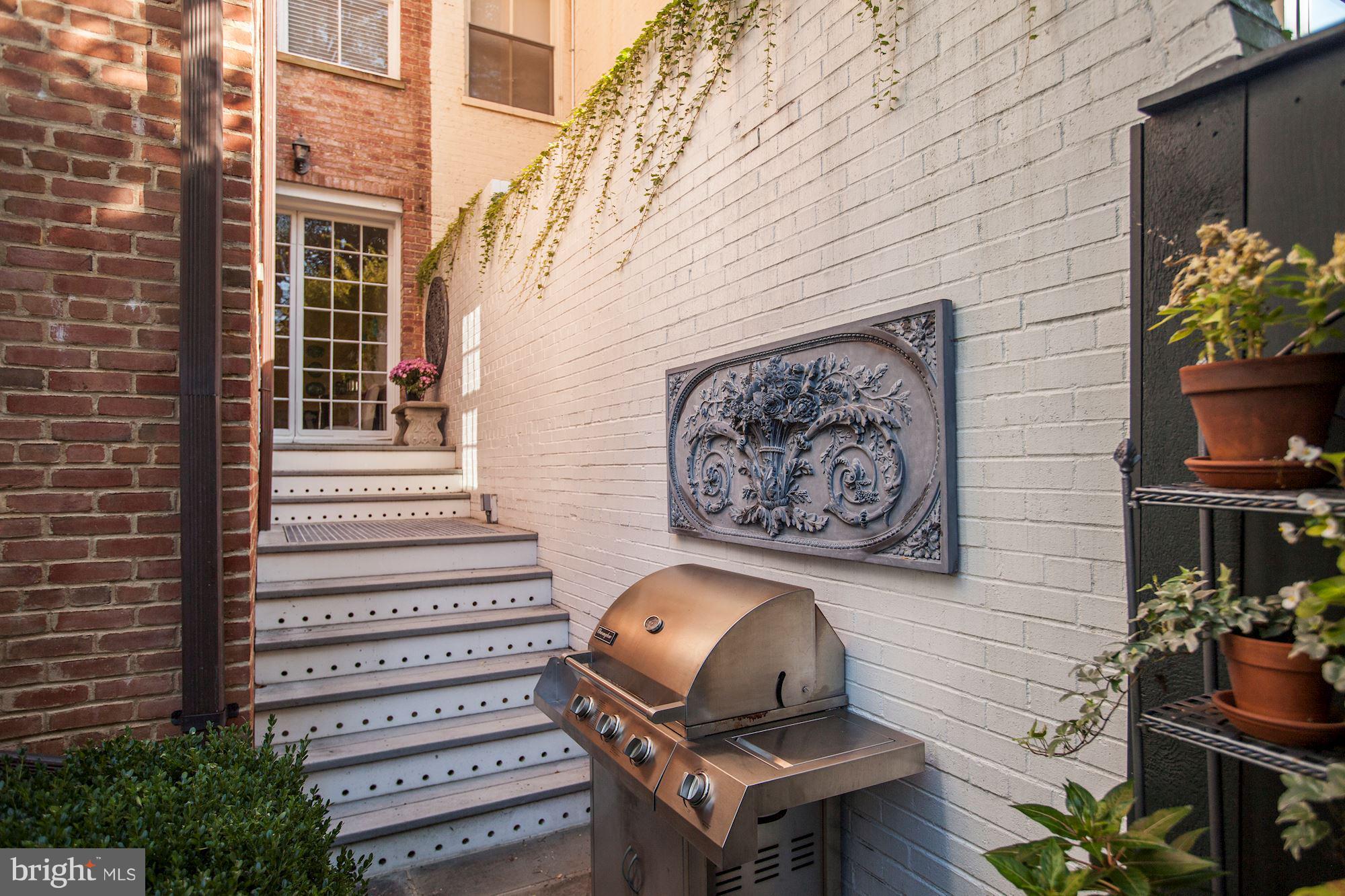 2326 California Street Northwest Washington, DC 20008 - Photo 28 of 30 a front view of a house with outdoor seating