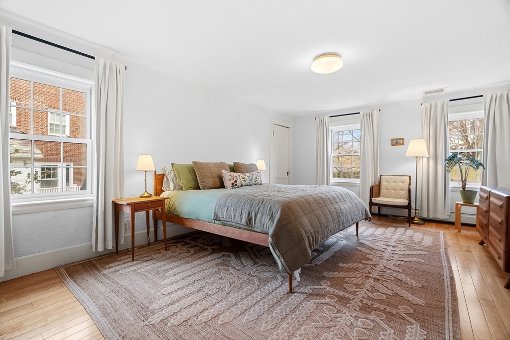 61 Huntington Road Newton, MA 02458 - Photo 21 of 41 a bedroom with a bed and wooden floor