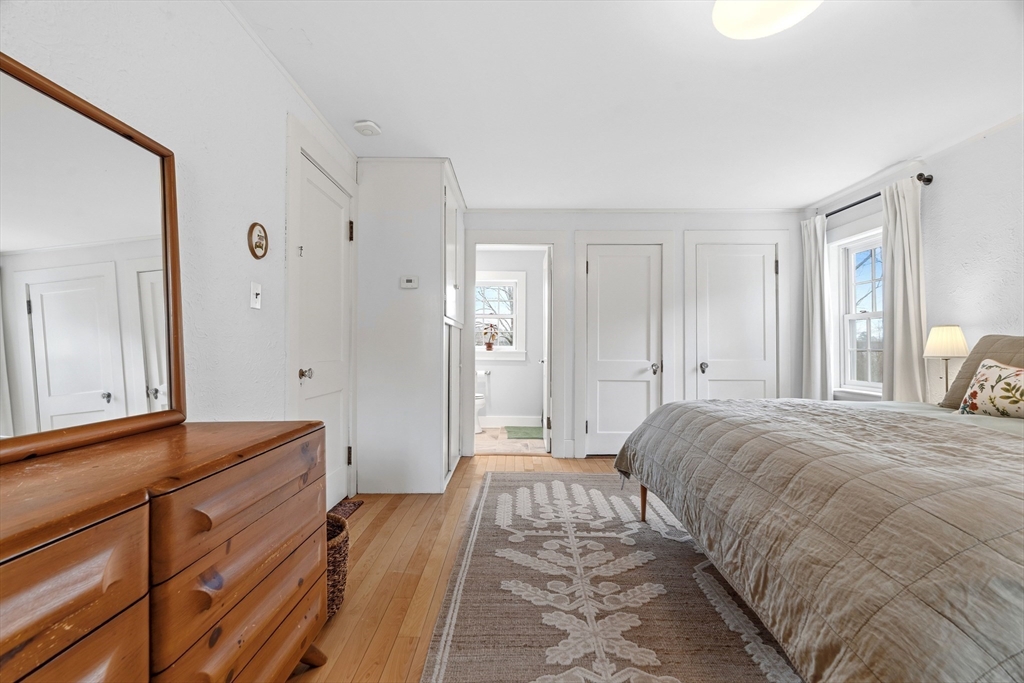 61 Huntington Road Newton, MA 02458 - Photo 23 of 41 a bedroom with a bed and a mirror