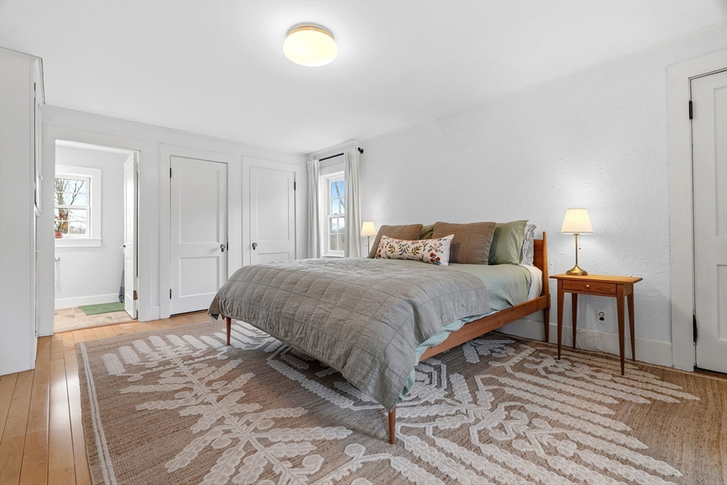 61 Huntington Road Newton, MA 02458 - Photo 24 of 41 a bedroom with a bed and wooden floor