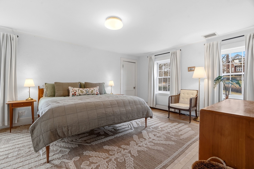 61 Huntington Road Newton, MA 02458 - Photo 25 of 41 a bedroom with a bed a table and chair