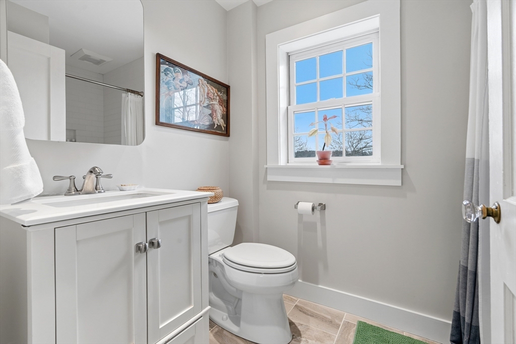 61 Huntington Road Newton, MA 02458 - Photo 27 of 41 a white toilet sitting next to a bathroom sink