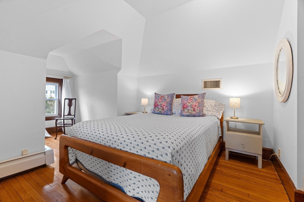 61 Huntington Road Newton, MA 02458 - Photo 32 of 41 a bedroom with a bed and a lamp