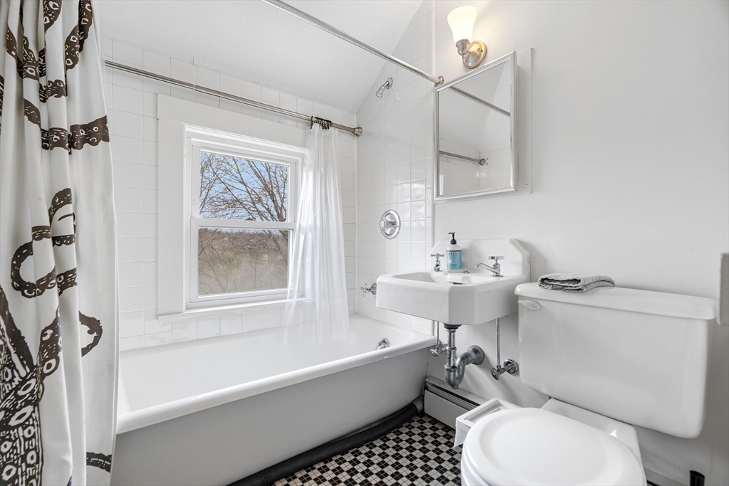 61 Huntington Road Newton, MA 02458 - Photo 34 of 41 a bathroom with a sink toilet and shower