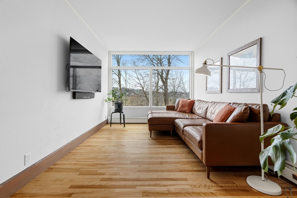 61 Huntington Road Newton, MA 02458 - Photo 9 of 41 a living room with furniture and a flat screen tv