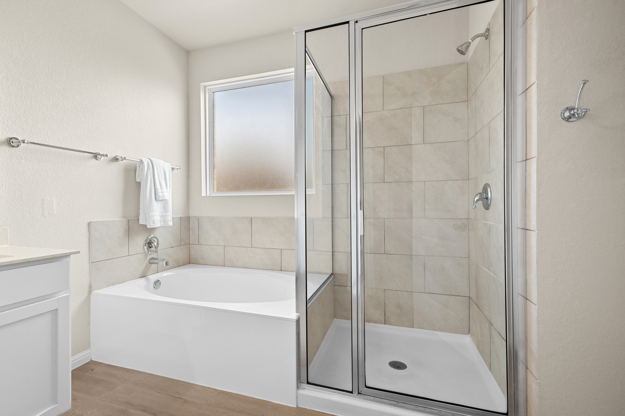 2413 Starhill Ranch Street Georgetown, TX 78628 - Photo 21 of 40 a white bath tub sitting next to a shower