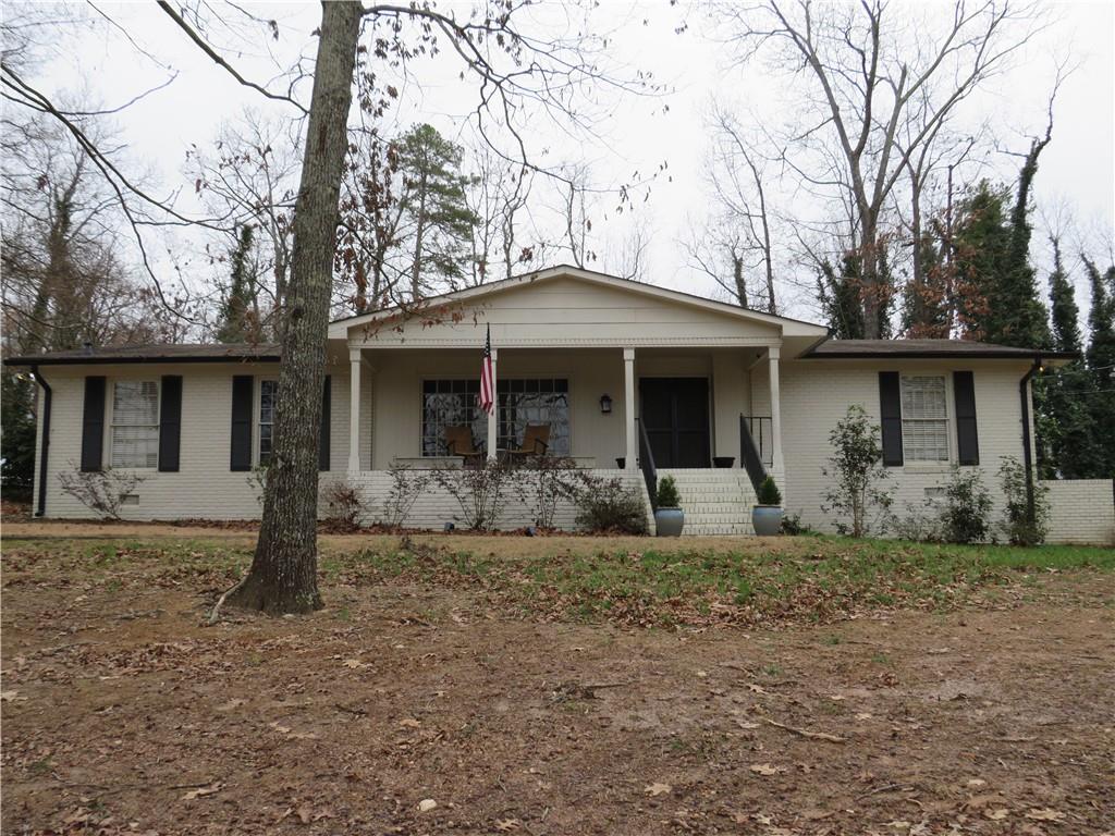 715 Cherokee Road Cedartown, GA 30125 - Photo 1 of 1 a front view of a house with a garden