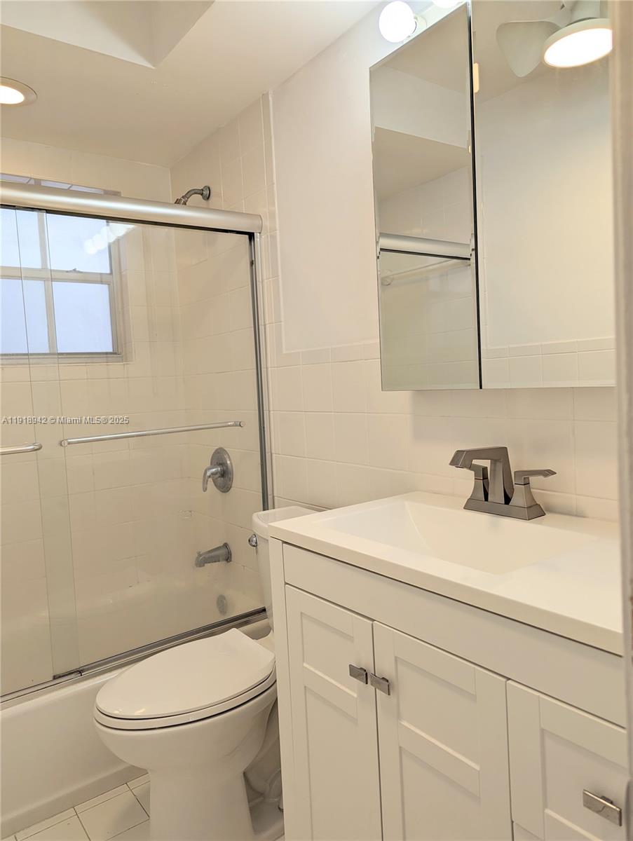 201 Galen Drive, Unit 215W Key Biscayne, FL 33149 - Photo 7 of 18 a bathroom with a sink a toilet and shower