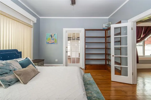 a view of a livingroom with a ceiling fan and window
