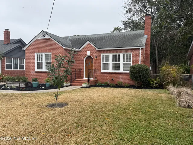 a kitchen with stainless steel appliances granite countertop a sink and a stove