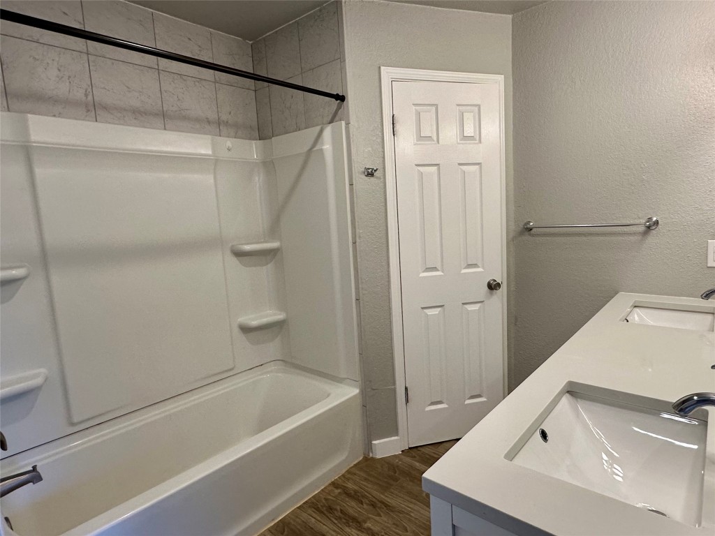 804 Brookside Pass Cedar Park, TX 78613 - Photo 7 of 15 a bathroom with a tub a sink and a shower