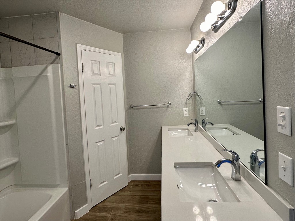 804 Brookside Pass Cedar Park, TX 78613 - Photo 8 of 15 a bathroom with a tub sink and mirror