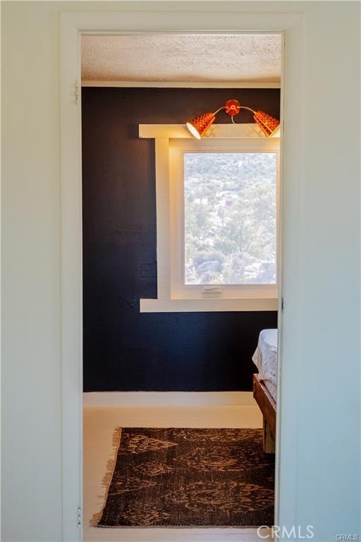 48317 Burns Canyon Road Pioneertown, CA 92268 - Photo 15 of 41 a room with a bed and a window