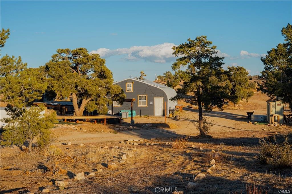 48317 Burns Canyon Road Pioneertown, CA 92268 - Photo 20 of 41 a view of a town with many trees