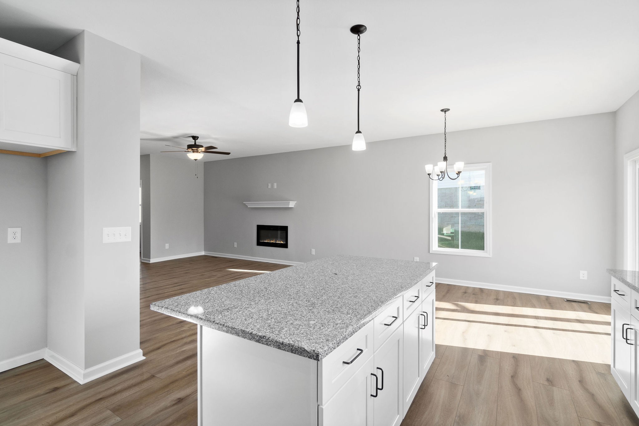 1042 Winesap Road Clarksville, TN 37040 - Photo 16 of 33 a kitchen with stainless steel appliances granite countertop a sink a oven and a wooden floor
