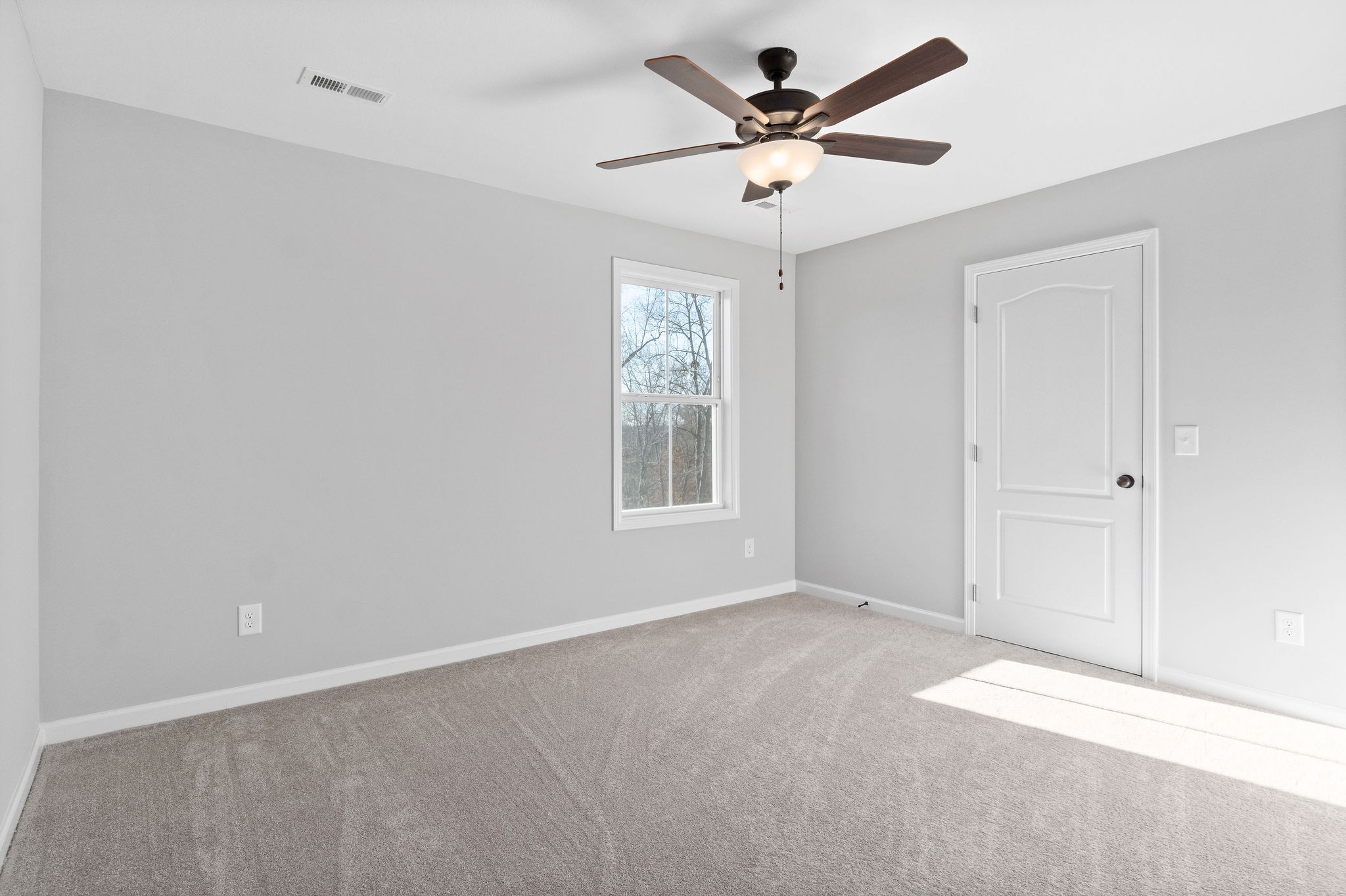 1042 Winesap Road Clarksville, TN 37040 - Photo 23 of 33 an empty room with a window and a fan
