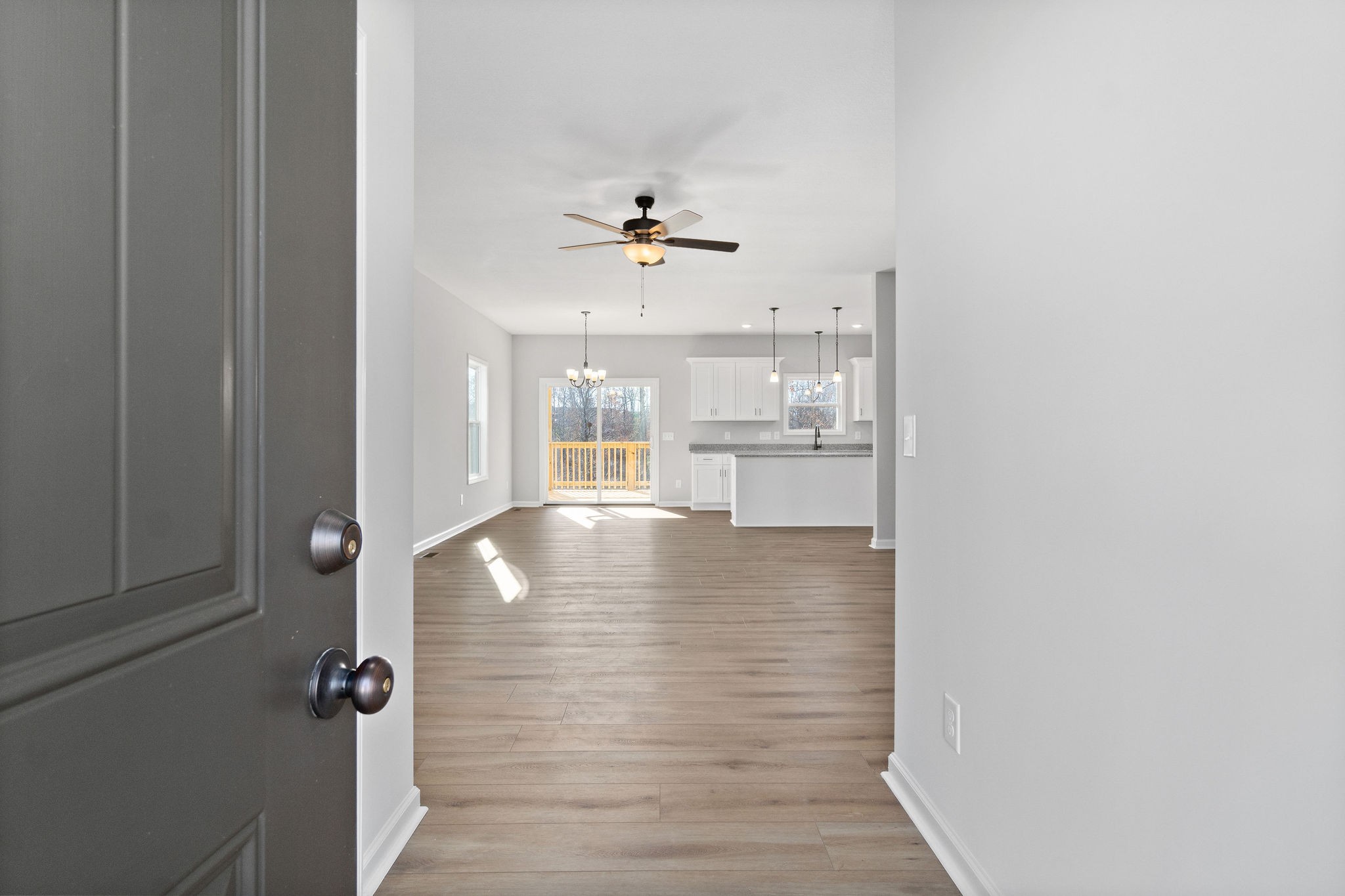 1042 Winesap Road Clarksville, TN 37040 - Photo 5 of 33 wooden floor in an empty room with a window
