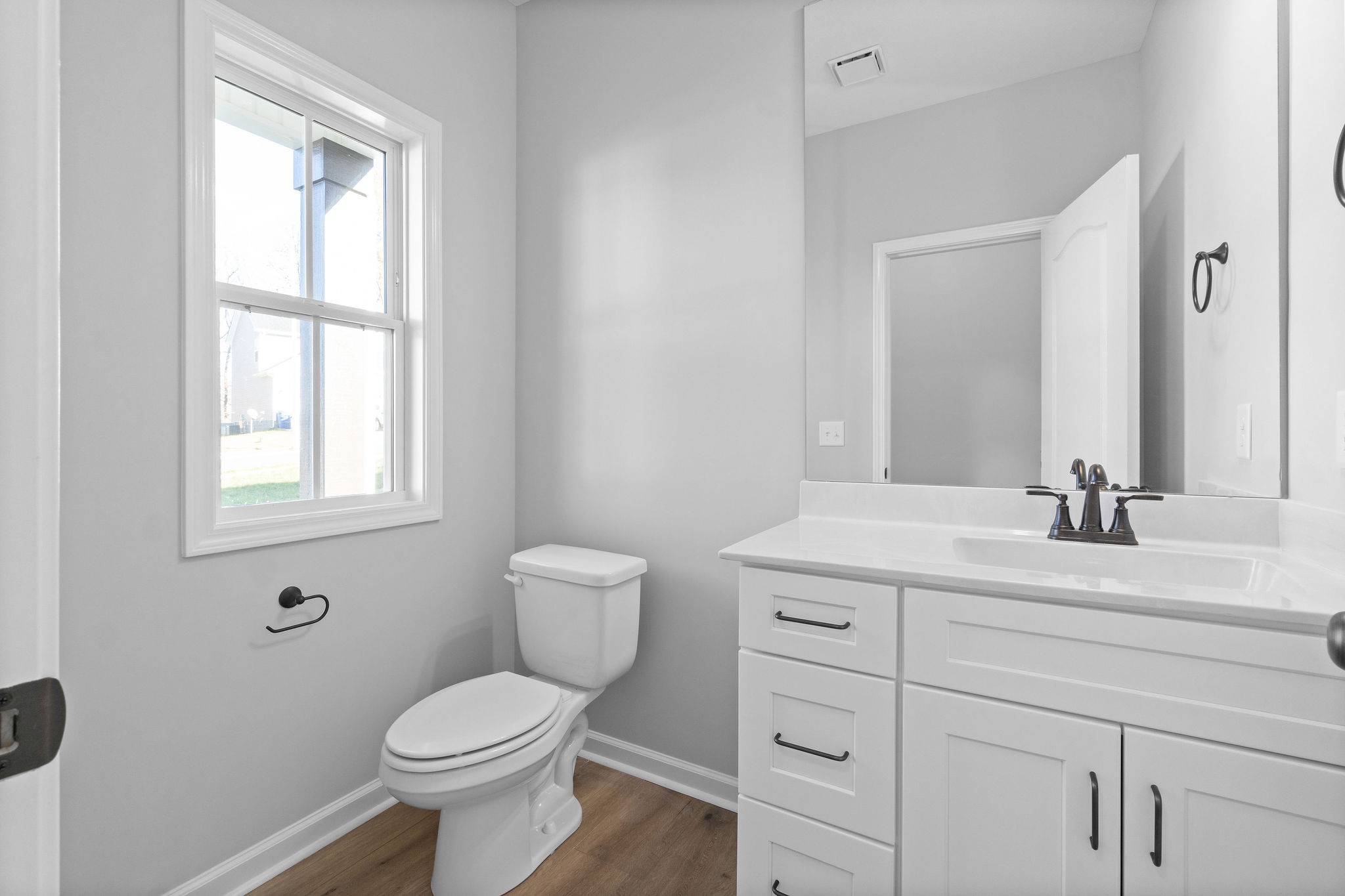 1042 Winesap Road Clarksville, TN 37040 - Photo 6 of 33 a bathroom with a toilet sink and mirror