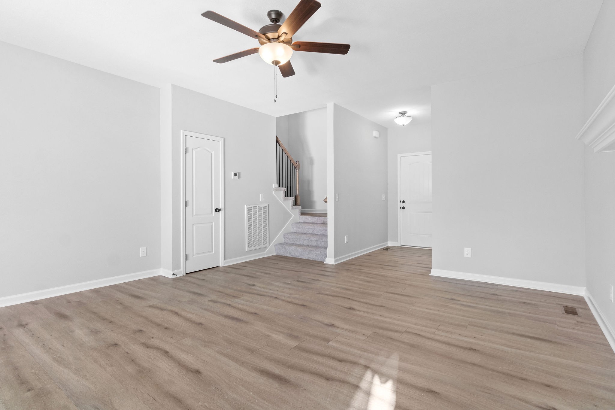 1042 Winesap Road Clarksville, TN 37040 - Photo 9 of 33 a view of an empty room with wooden floor