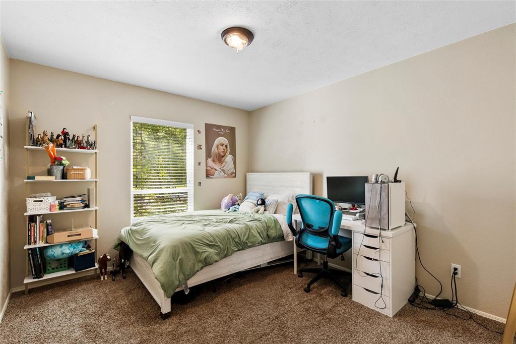 9212 Shipman Street Rowlett, TX 75088 - Photo 21 of 34 Bedroom with carpet and an office area