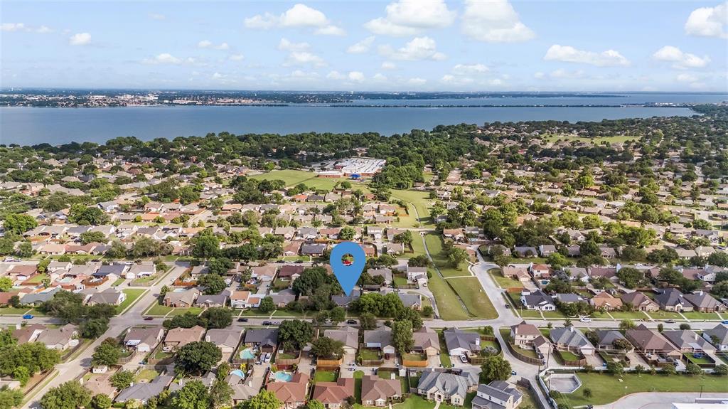 9212 Shipman Street Rowlett, TX 75088 - Photo 33 of 34 Aerial perspective of suburban area featuring a nearby body of water