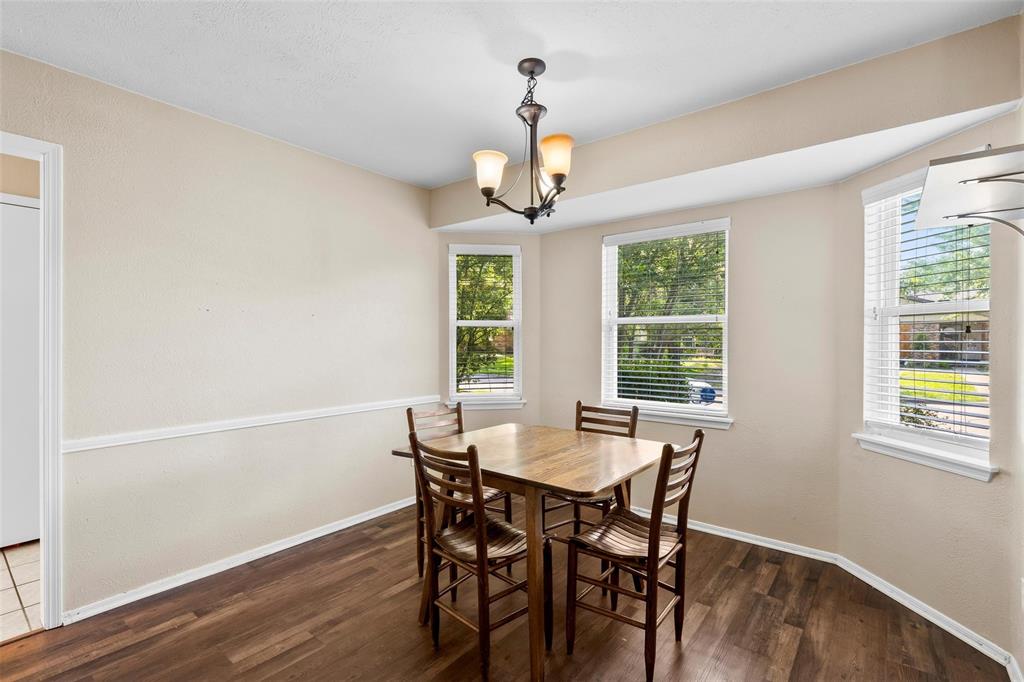 9212 Shipman Street Rowlett, TX 75088 - Photo 4 of 34 Dining room with a chandelier and dark wood-style flooring