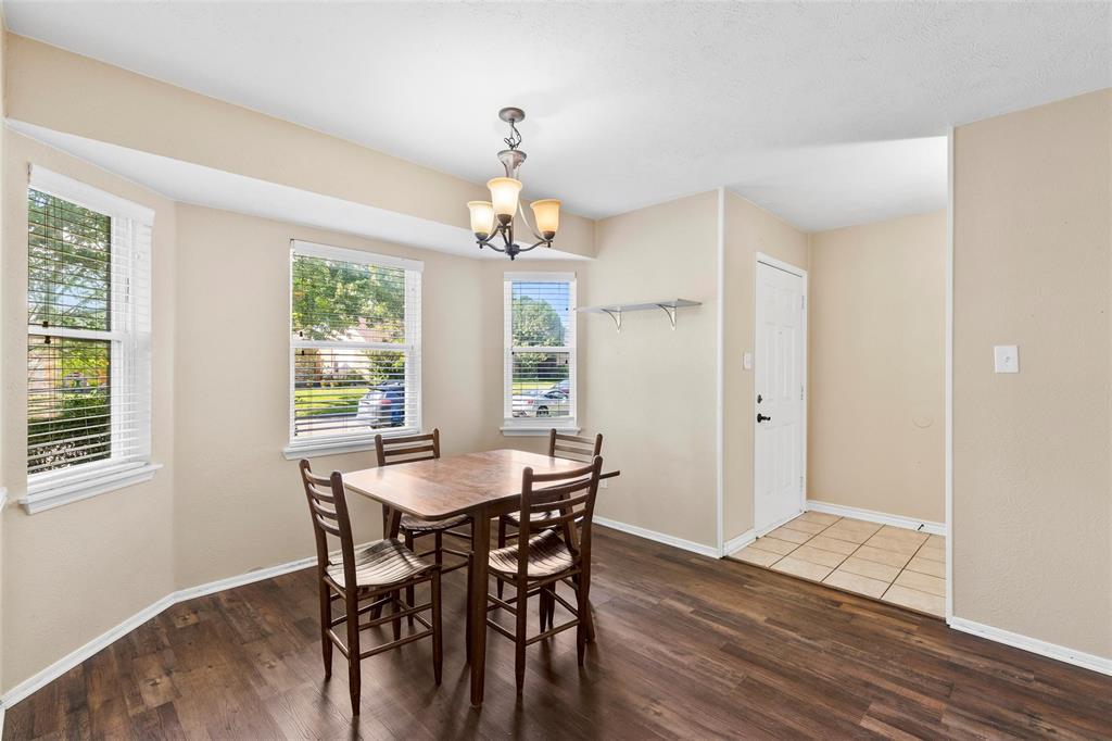 9212 Shipman Street Rowlett, TX 75088 - Photo 5 of 34 Dining room featuring wood finished floors and a chandelier