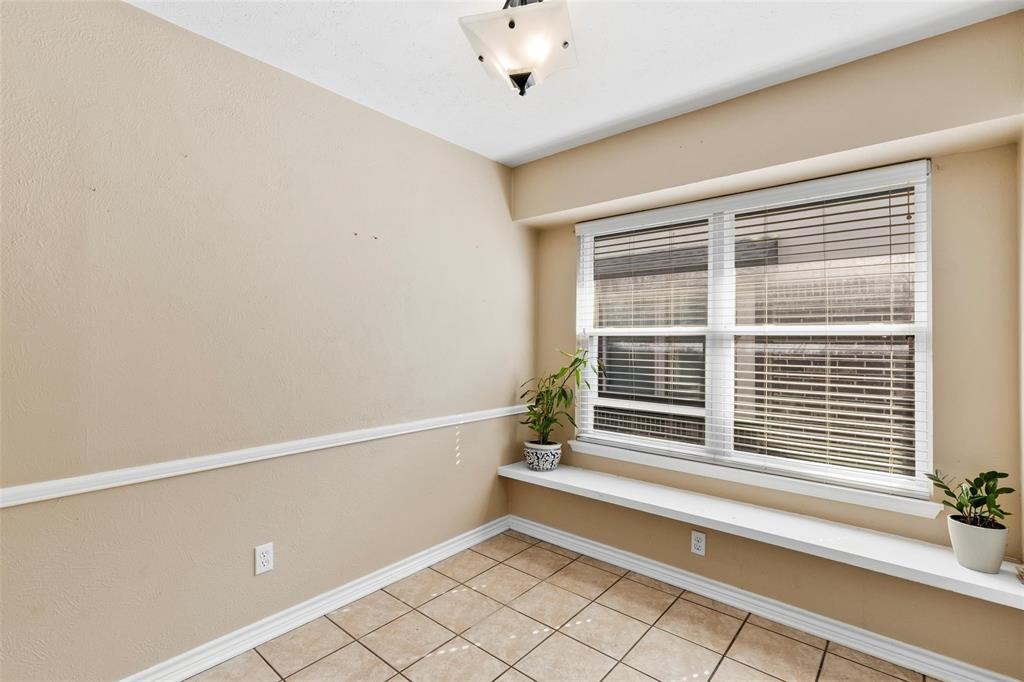 9212 Shipman Street Rowlett, TX 75088 - Photo 7 of 34 Breakfast nook featuring light tile patterned floors and baseboards