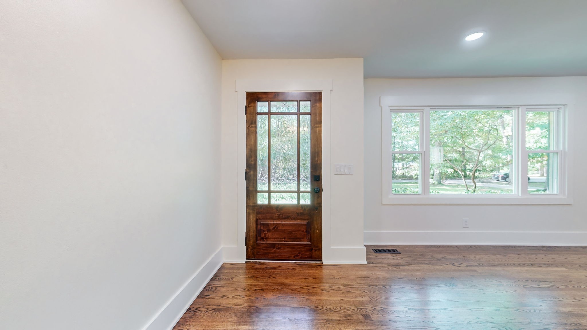 196 Thomas Street Manchester, TN 37355 - Photo 13 of 43 an empty room with wooden floor and windows