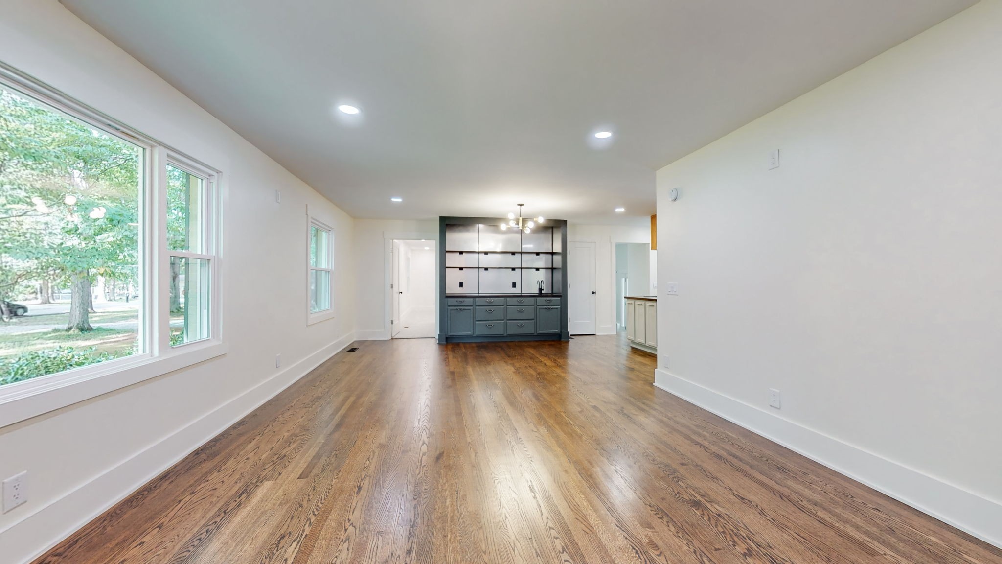 196 Thomas Street Manchester, TN 37355 - Photo 14 of 43 a view of empty room with wooden floor and windows