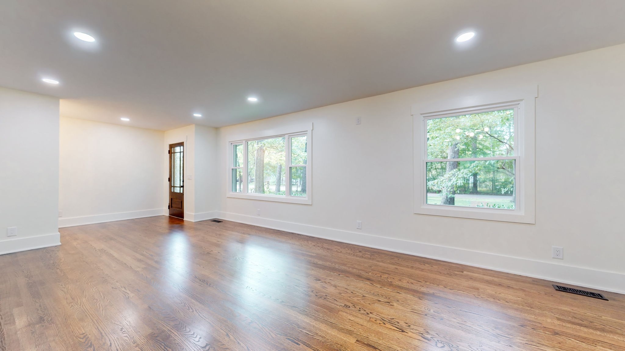 196 Thomas Street Manchester, TN 37355 - Photo 15 of 43 an empty room with wooden floor and windows
